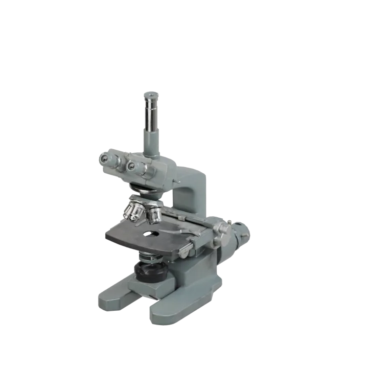 An industrial microscope with a binocular head.