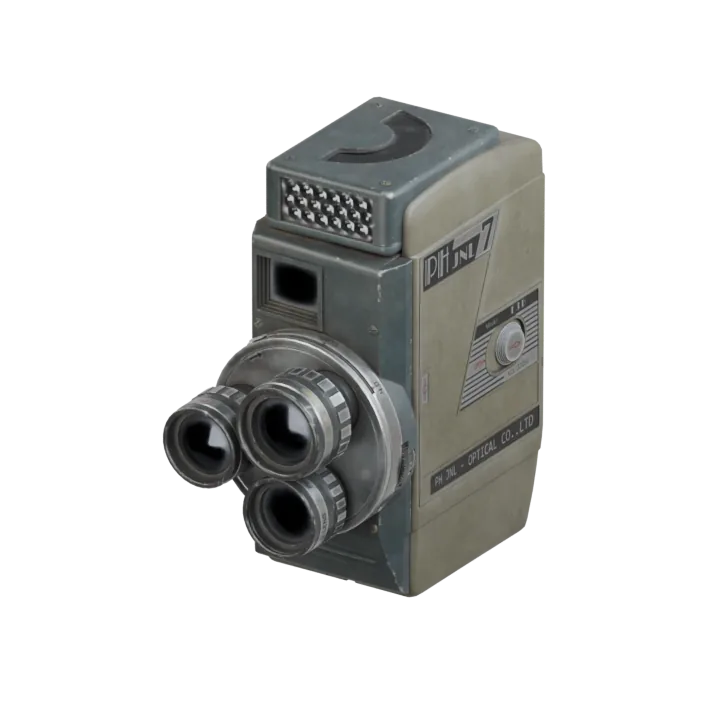 A vintage movie camera with multiple lenses.